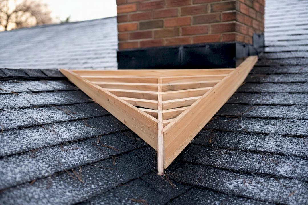 When Do You Need a Chimney Cricket? IRC Requirements Explained